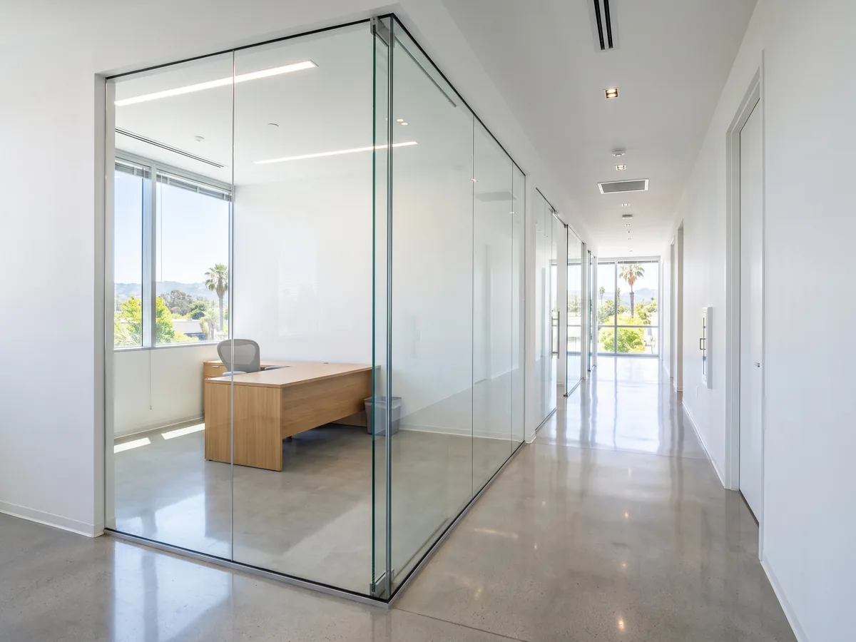 Plain untreated glass partition before frosted window film